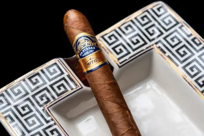 A brown cigar with a decorative band labeled 