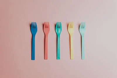 Five colorful children's forks. 