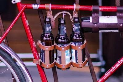 Wine and bottle carriers on a red bike.