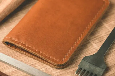 A tan leather checkbook with real American leather.