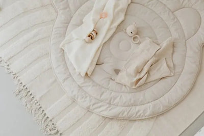 Two cloth baby wipes on a baby pad.