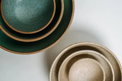 Six decorative bowls stacked on each other.