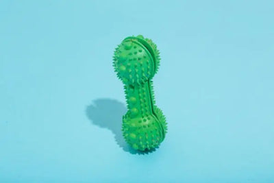 A dog toy waiting to be played with while bringing peace of mind due to the ingredients going into the product and being made in America. 