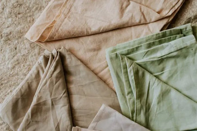 Three flat bed sheets each made in the USA with 100% organic cotton.