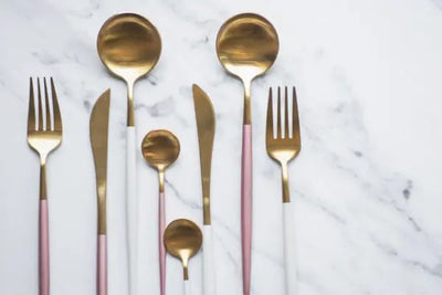 Golden forks, spoons and ladles.