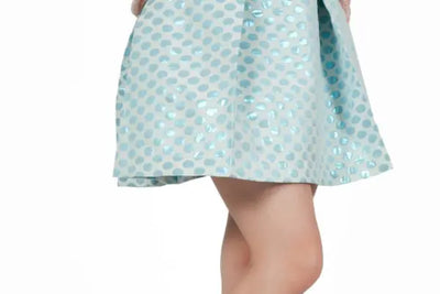 A white skirt with blue polka dots was made in America with organic cotton.