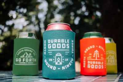 Blue and green can koozies.
