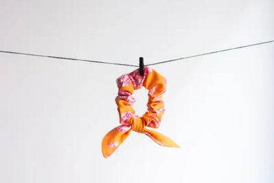 Orange hair scrunchies and headbands that were made in Pennsylvania. 