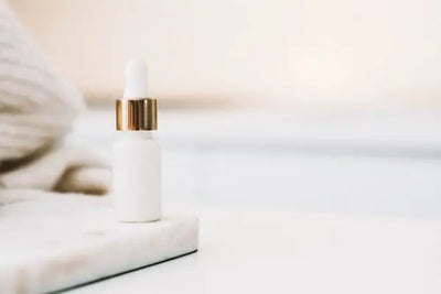A white skincare bottle with gold accents were manufactured in America, bringing elegance and organic solutions to skincare. 