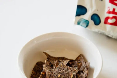 A bowl of chips, which were made in America, are partly eaten. 