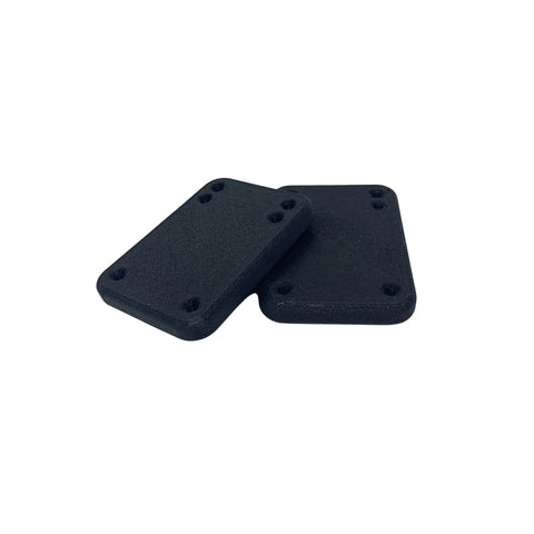 Two Chatelet Manufacturing Longboard/Skateboard 1/4 Inch Premium Riser Shock Pads overlap on a white background. Made from durable TPU/plastic, they boost riding quality and shock absorption for extra protection and support.