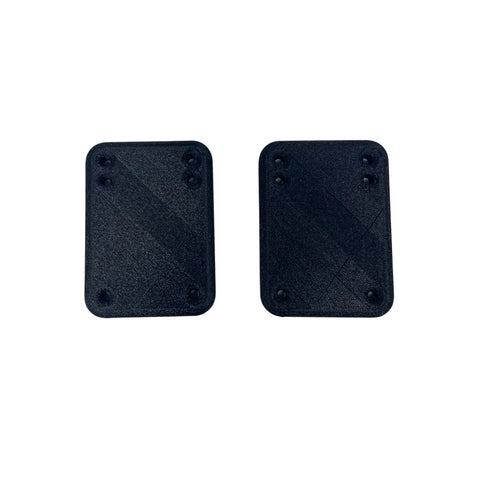 Two black Chatelet Manufacturing 1/4 Inch Premium Riser Shock Pads for skateboards, each rectangular with four corner holes, are shown side by side on a white background—designed for enhanced riding quality and increased shock absorption.