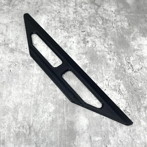 The Chatelet Manufacturing 10-Inch Plastic Paint Guide and Trim Guard, featuring rigid construction and two cut-out sections, rests on a textured light gray surface—ideal for precision painting on DIY or professional jobs.