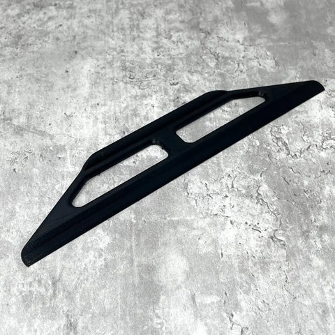 A 10-Inch Plastic Paint Guide and Trim Guard by Chatelet Manufacturing rests on a textured gray surface. This rigid, lightweight tool is ideal for achieving clean, straight paint lines during DIY or professional projects.