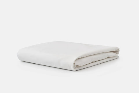 The American Blossom Linens Cotton Single [Separate] Fitted Bed Sheet, crafted from luxurious USA-grown cotton, is neatly folded and placed on a plain white background.