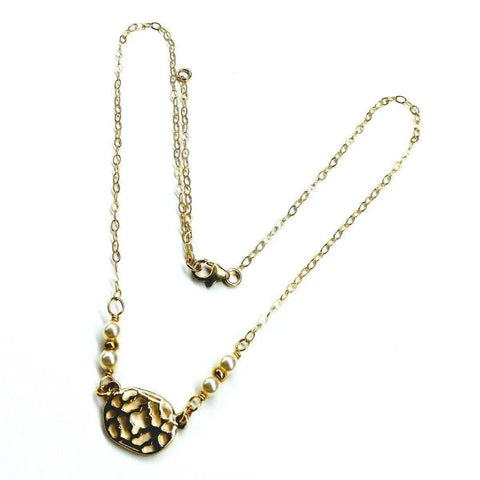 The Alexa Martha Designs As Seen on Molly Ringwald 14K Gold Filled Filigree Pearl Choker Necklace features a textured abstract gold pendant with gold and white beads, shown on a white background.