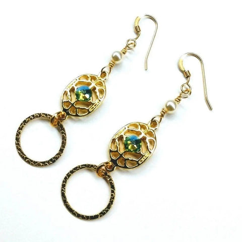Alexa Martha Designs 14 KT Gold Filled Green Crystal Hammered Circle Filigree Earrings feature textured ovals, circular shapes, blue accents, and small pearls set against a white background.