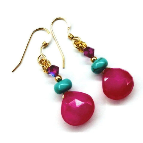 The 14 KT Gold Filled Wire Wrapped Pink and Turquoise Drop Gemstone Earrings by Alexa Martha Designs feature faceted hot pink chalcedony, turquoise beads, and purple crystals in a vibrant dangle style.