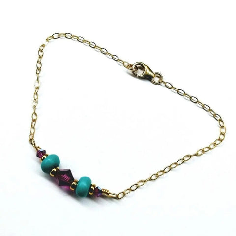 The Gold Filled Pink Turquoise Gemstone Bracelet by Alexa Martha Designs features pink turquoise beads and gold spacers, elegantly showcased on a white background.