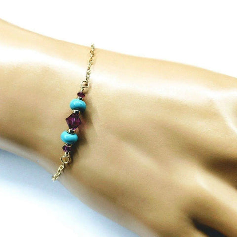 The Alexa Martha Designs Gold Filled Pink Turquoise Gemstone Bracelet is displayed on a mannequin hand against a white background, highlighting its exquisite handcrafted jewelry design.