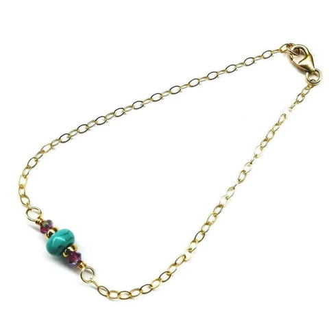 The 14K Gold Filled Pink and Turquoise Gemstone Dainty Bracelet by Alexa Martha Designs features a handmade design with turquoise and pink beads, secured with a lobster clasp for an elegant touch.