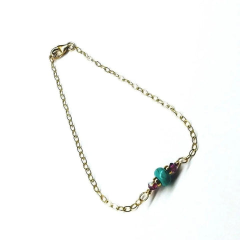 The Alexa Martha Designs 14K Gold Filled Pink and Turquoise Gemstone Dainty Bracelet features a delicate gold-filled chain with pink and turquoise beads, shown against a white background.
