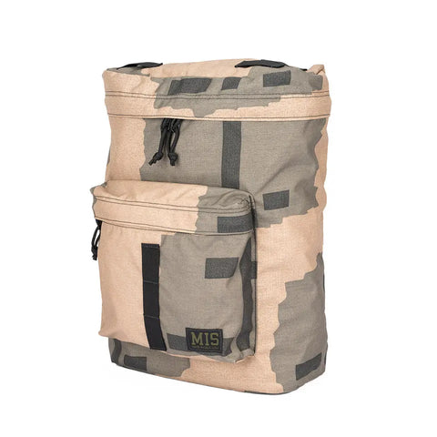 The MIS Backpack - T Pattern is a tan and gray camo durable backpack with a front zipper pocket, black zipper pulls, an MIS logo patch, rugged rectangular shape, built-in laptop holder, and is made in the USA.