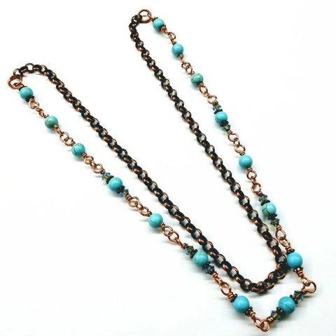 The Alexa Martha Designs Wire Wrapped 24 Inches Copper Turquoise Necklace features alternating black links and round turquoise beads, beautifully displayed on a white background.
