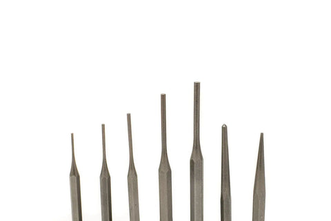 A set of seven Grace USA Steel Punches by Grace USA, each with different shapes and sizes, is arranged upright against a white background.