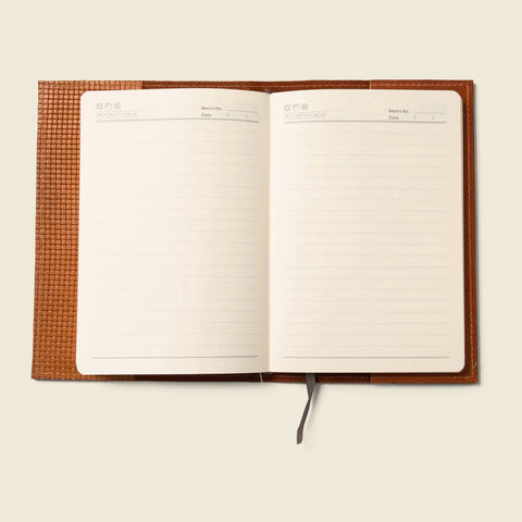 CASUPO’s Limited Edition Tan Refillable A5 Leather Notebook Cover features a textured finish, lined and blank pages, and a gray ribbon bookmark, shown on a light beige background.