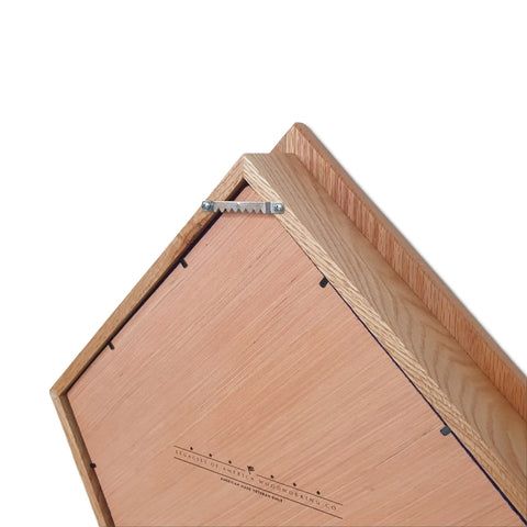 Back view of the Air Force Modern Wings Shadow Box - Oak With Walnut Wings by Legacies of America Woodworking Company, made in the USA, featuring a metal sawtooth hanger, wood grain, and detailed corners.