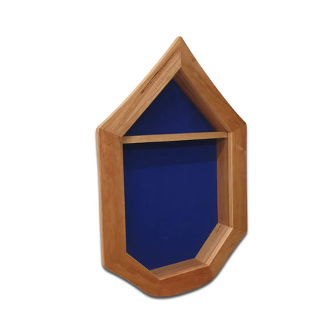 The Air Force SNCO Military Retirement Shadow Box - Cherry by Legacies of America Woodworking Company is a house-shaped display case with a pointed roof, blue background, and single shelf, expertly crafted in the USA from cherry hardwood. Photographed on white.