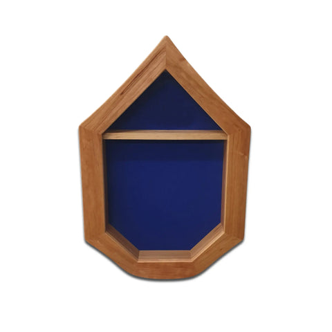 The Air Force SNCO Military Retirement Shadow Box - Cherry by Legacies of America Woodworking Company features a pentagon-shaped cherry hardwood frame, blue felt background, and a single shelf, displayed on a white surface.