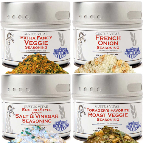Four tins from the Gustus Vitae Air Fryer Ultimate Veggies Seasoning Set—Extra Fancy Veggie, French Onion, Salt & Vinegar, and Roast Veggie—are displayed open with a small pile of each artisanal blend in front.