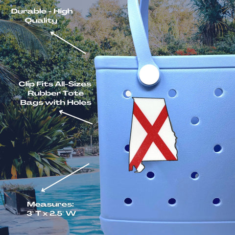 Close-up of a blue rubber tote bag by a pool, featuring a Chatelet Manufacturing Boglets USA Flag Charm. This durable 3x2.5 charm fits Bogg Bags and other totes with holes—perfect for displaying your patriotism.