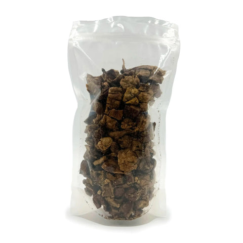 A clear, resealable pouch displays Brewscuits All Dried Up: brown, irregular dehydrated dog snacks made from all-natural beef lung, shown against a white background.