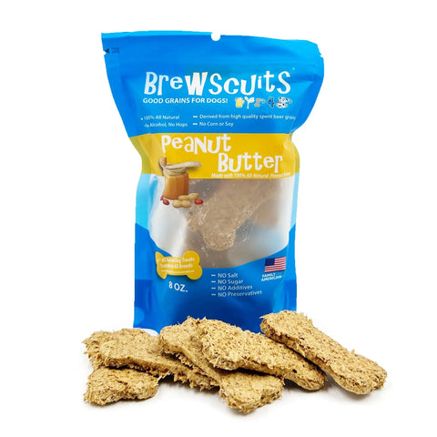 A blue Brewscuits Original bag stands upright, showcasing eco-conscious dog treats made with all-natural ingredients, upcycled grains, and no preservatives. Rectangular, textured treats are spread in front of the packaging.