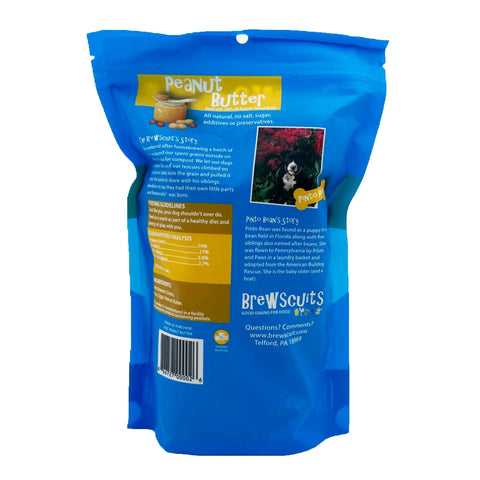 Blue bag of Brewscuits Original dog treats by Brewscuits, labeled Peanut Butter. The back shows product info, feeding guidelines, nutrition facts, and a black-and-white dog with Pinto Beans Story—made with upcycled grains for eco-friendly treats.