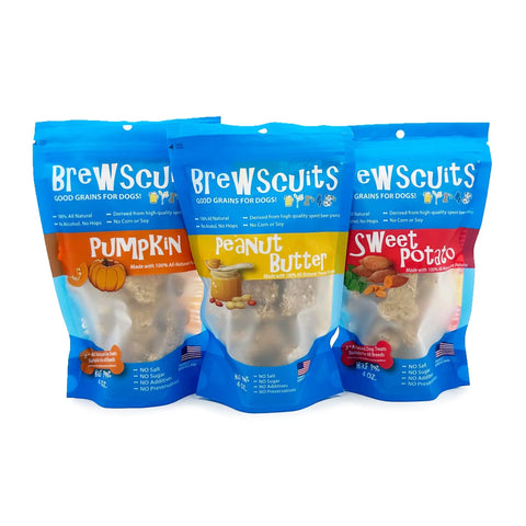 Three blue Brewscuits Half Pints bags are displayed side by side, showing pumpkin, peanut butter, and sweet potato flavors. Each bag has a clear window revealing bone-shaped dog biscuits inside.