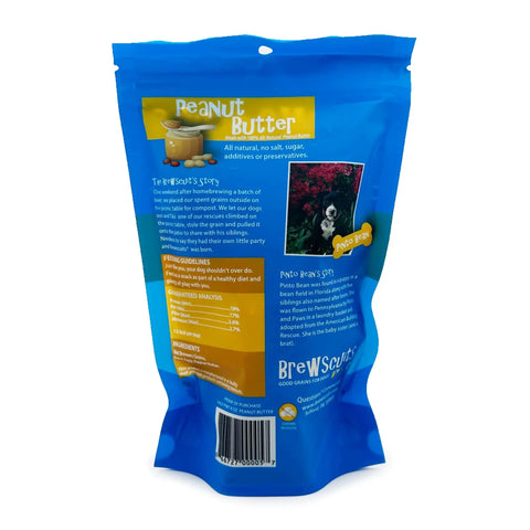 The back of a blue Brewscuits Half Pints pouch lists ingredients, nutrition info, a story about these natural dog treats, a small dog photo, and a barcode at the bottom. Perfect for pups who love wholesome Brewscuits biscuits!.