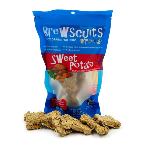 A blue and red Brewscuits Half Pints bag stands upright, with tan biscuit-shaped treats in front. The packaging highlights these natural dog treats are made from upcycled grains sourced from local breweries.