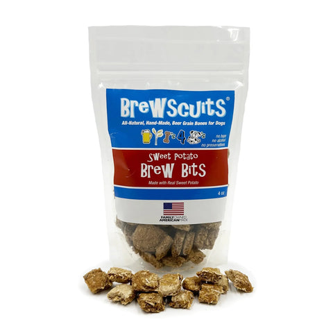 A clear resealable bag labeled Brewscuits Brew Bits with dog treats inside and scattered in front. The blue and red bag showcases that these natural dog treats are made for your pup’s enjoyment.