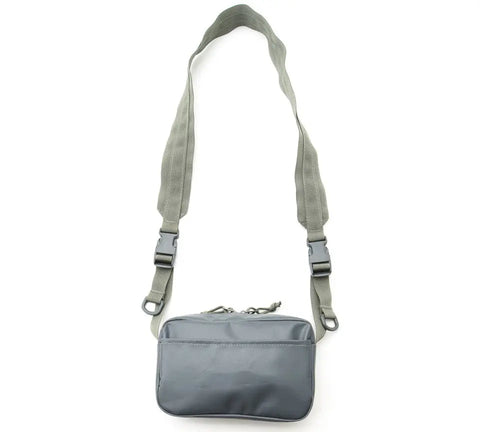 The MIS All Weather Shoulder Bag - Foliage is a small, rectangular gray bag with a wide adjustable strap, two plastic buckles, and a top zipper closure. Made in the USA, its shown against a white background.