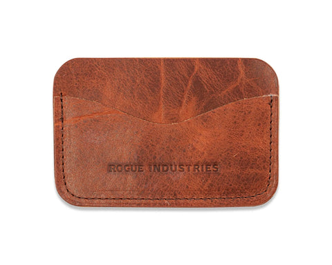 The Rogue Industries Bison Card Case is crafted from brown American Bison leather with visible stitching and Rogue Industries embossed on the front, made in Maine.