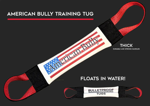 The American Bully Fire Hose Training Tug by Bulletproof Pet Products Inc is a white dog toy with red, thick, durable handles, strong black ends, and an American flag design. It floats in water. A smaller tug labeled Bulletproof Tugs is shown below.