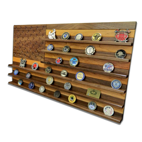 The Legacies of America Woodworking Company’s American Flag Challenge Coin Display – Walnut & Cherry features angled grooves to showcase multiple military and commemorative coins with vibrant emblems and unique designs.