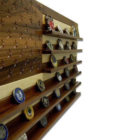 The Legacies of America Woodworking Company American Flag Challenge Coin Display - Walnut & Maple features carved stars and shelves for multiple coins, crafted by veterans in the USA, shown on a white background.