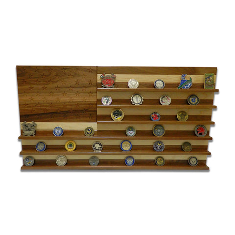 The Legacies of America Woodworking Company’s American Flag Challenge Coin Display - Walnut & Maple is a wooden, U.S.-made shelf shaped like the flag, with engraved stars and shelves for coins where the stripes appear.