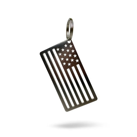 The Arotags American Flag Stainless Steel Key Chain features a cut-out stars and stripes design, made in the USA. Its durable build and vintage look make it a unique accessory, shown photographed on a white background.