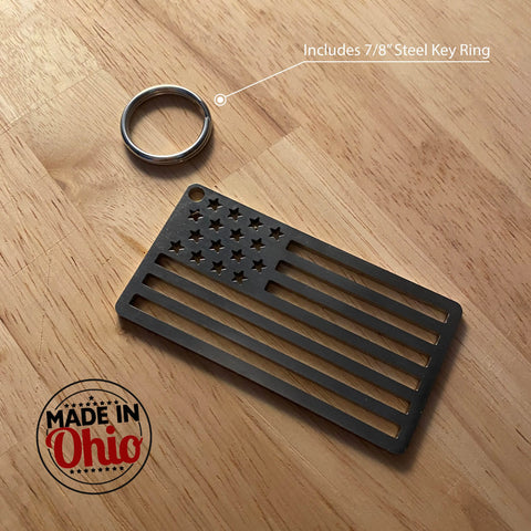 An American Flag Stainless Steel Key Chain by Arotags, featuring a patriotic flag design and a 7/8” steel key ring, sits on wood. “MADE IN Ohio” appears in the corner. Crafted in the USA.